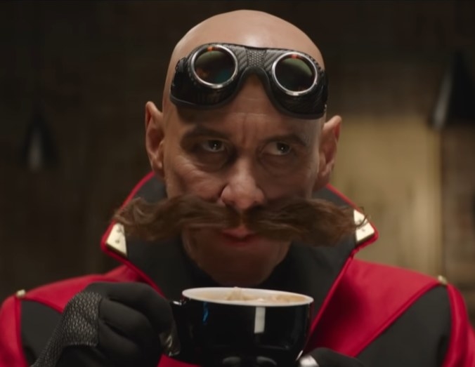Jim Carrey as a bald headed Doctor Robotnik sipping on a cappuccino