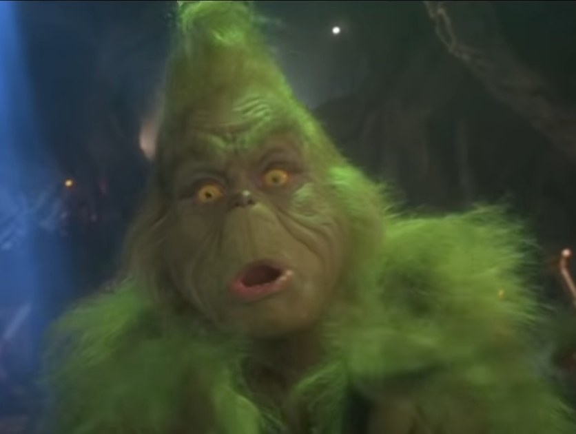 Jim Carrey as the Grinch trying to scare off a little girl