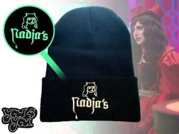 black beanie with white lettering that reads Nadja's