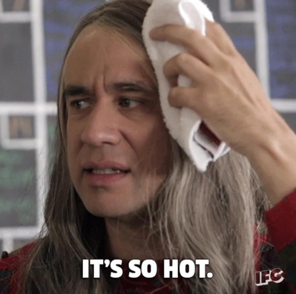 Fred Armisen in character saying, "It's so hot"