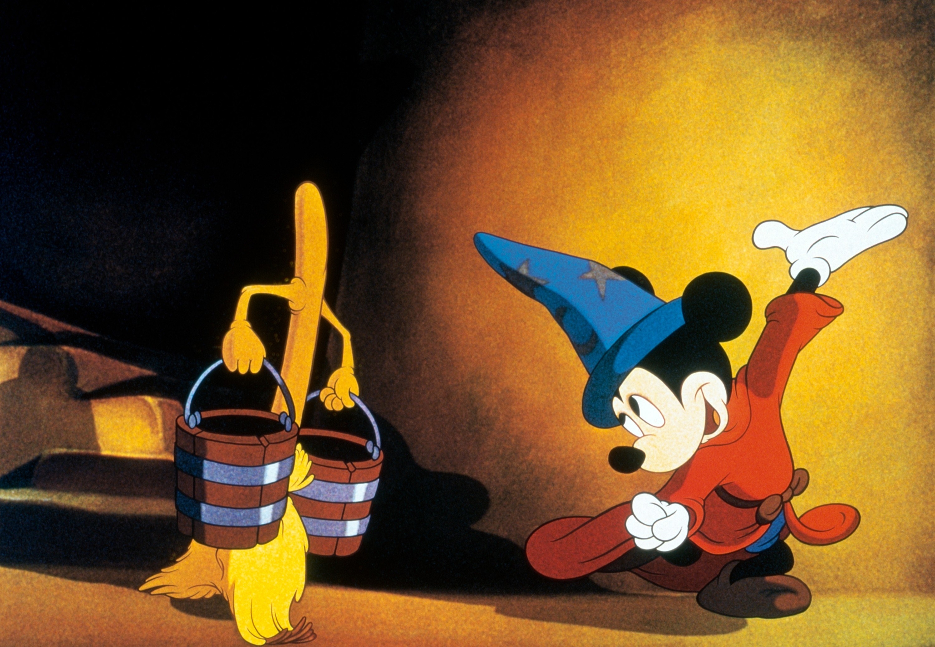 Mickey interacting with an animated broom holding buckets