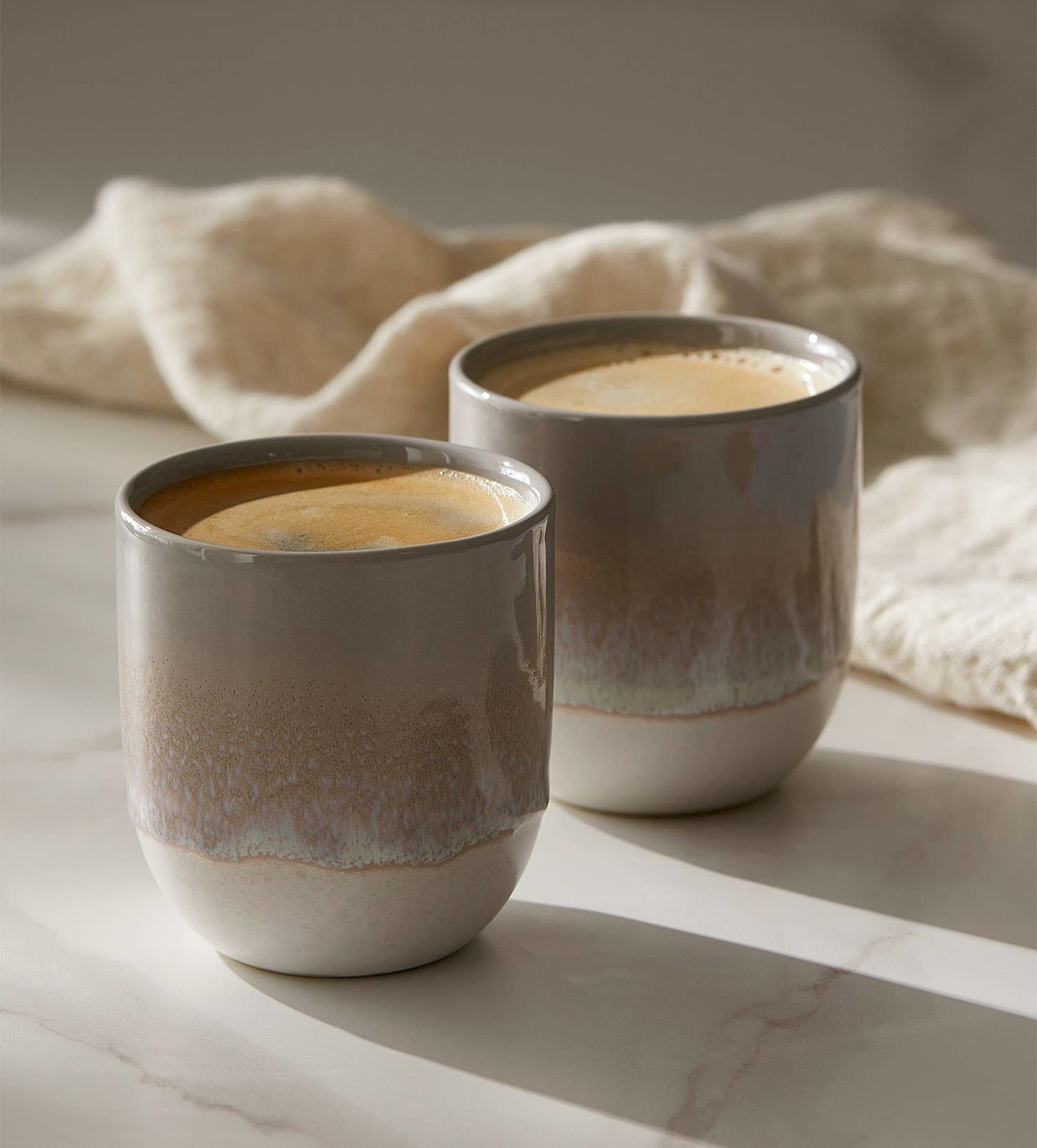 two stoneware mugs