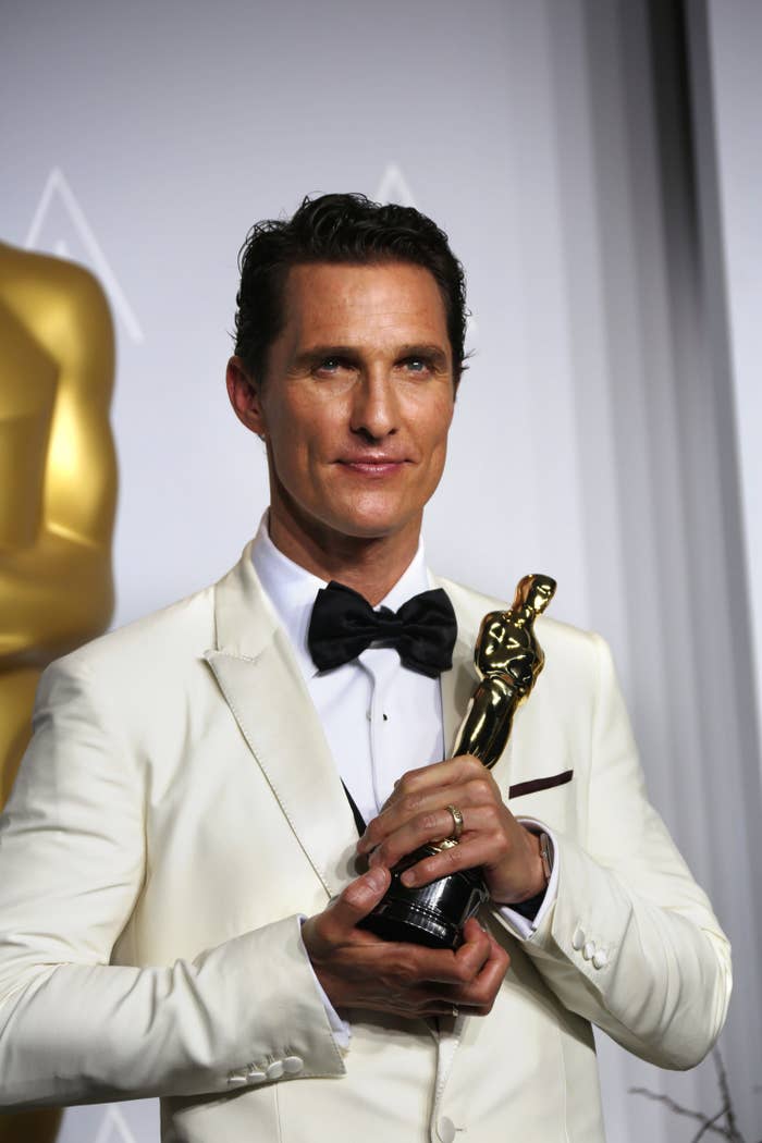 Matthew holding his Oscar