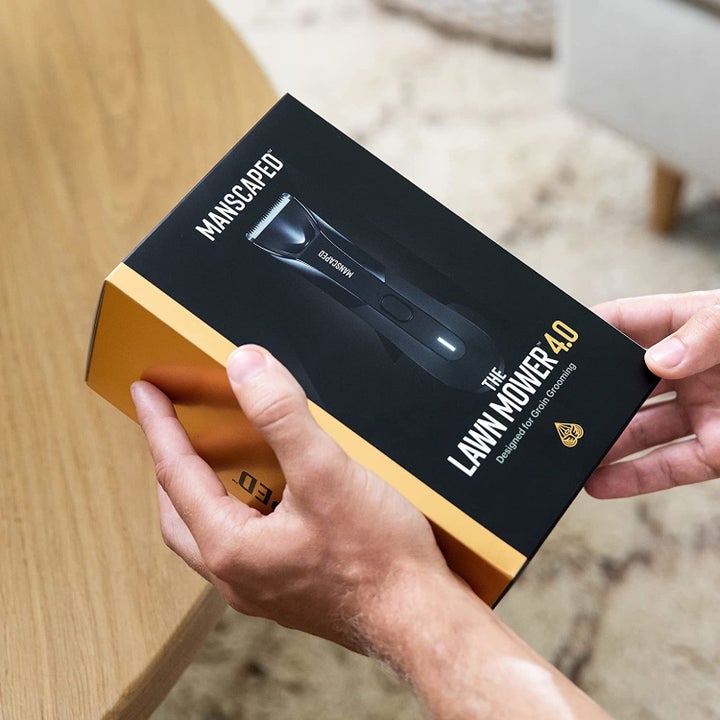 person holding the trimmer box