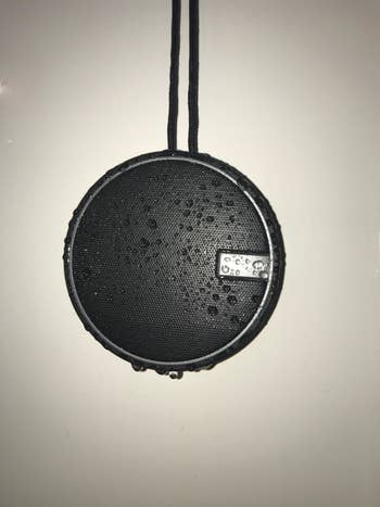 reviewer image of a wet black speaker