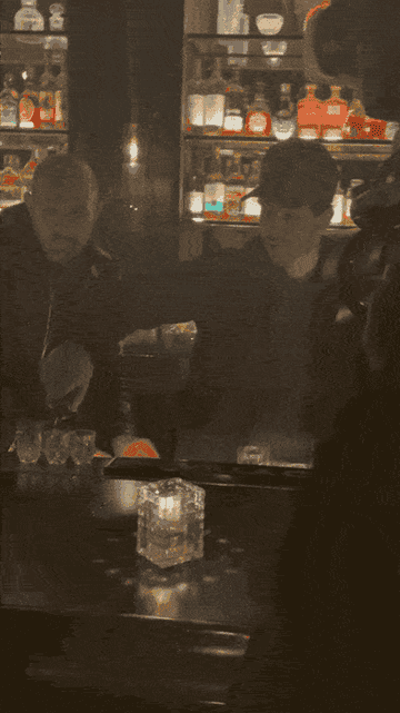 Nick Jonas pouring tequila shots