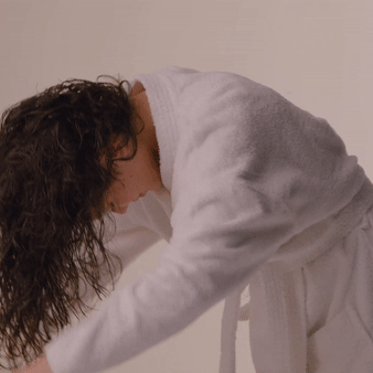 Gif of a model demonstrating how to use the towel