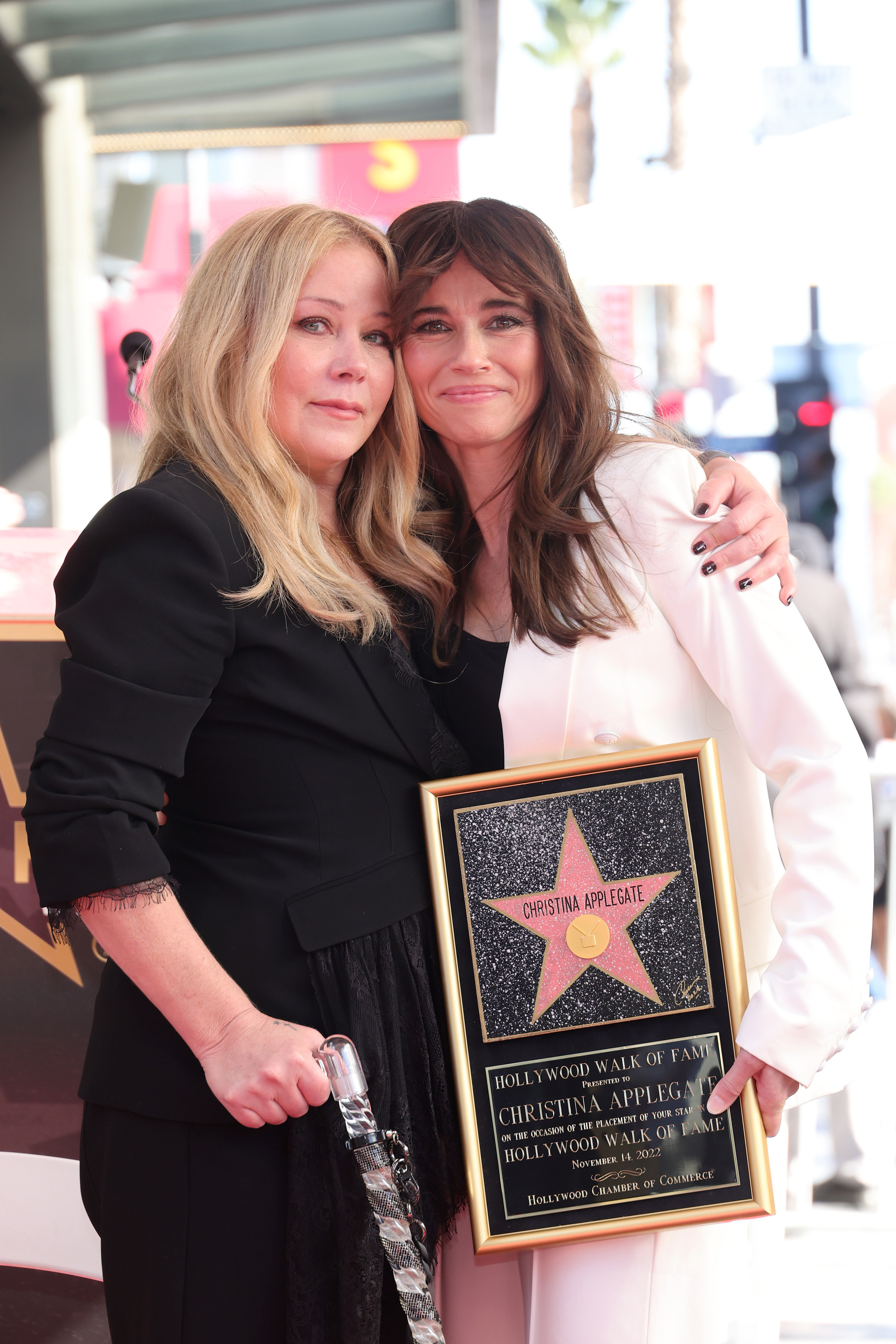Christina and Linda with their arms around each other at the walk of fame ceremony