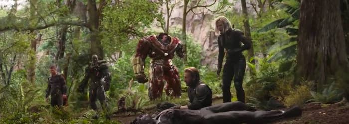 best movie endings list A group of superheroes stand around a body
