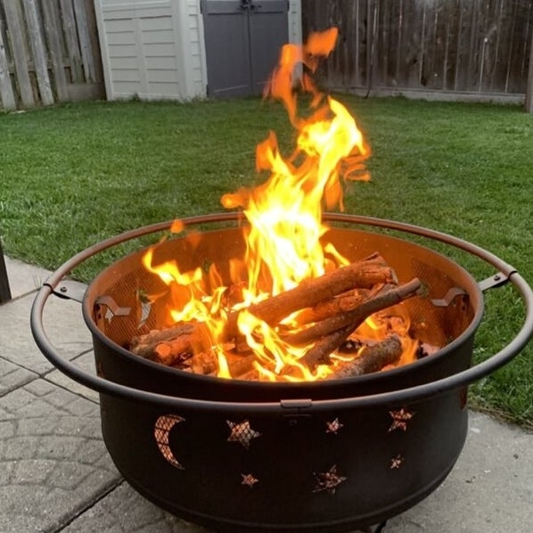 The fire pit with a fire in it