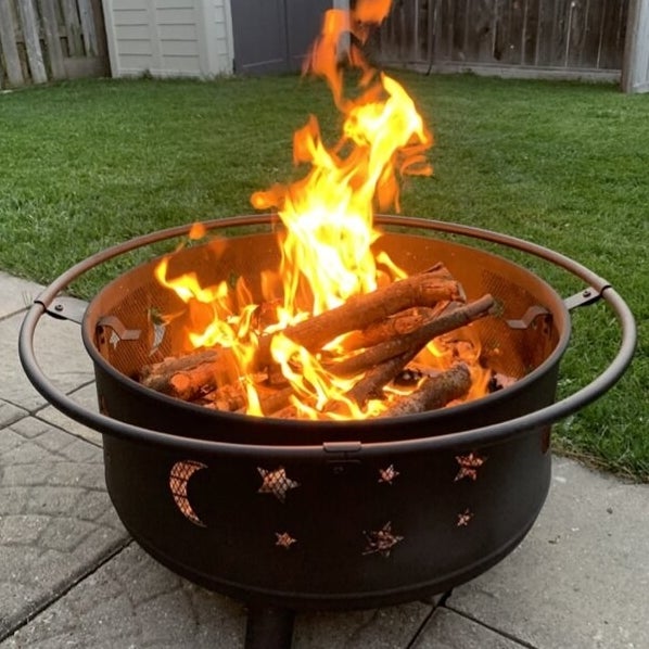 The fire pit with a fire in it