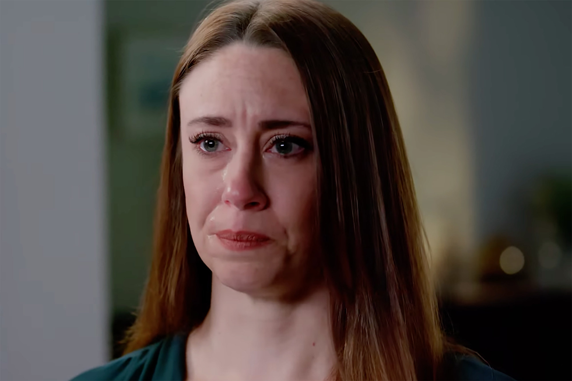 Casey Anthony cries in a close-up on her face in this screenshot from a documentary