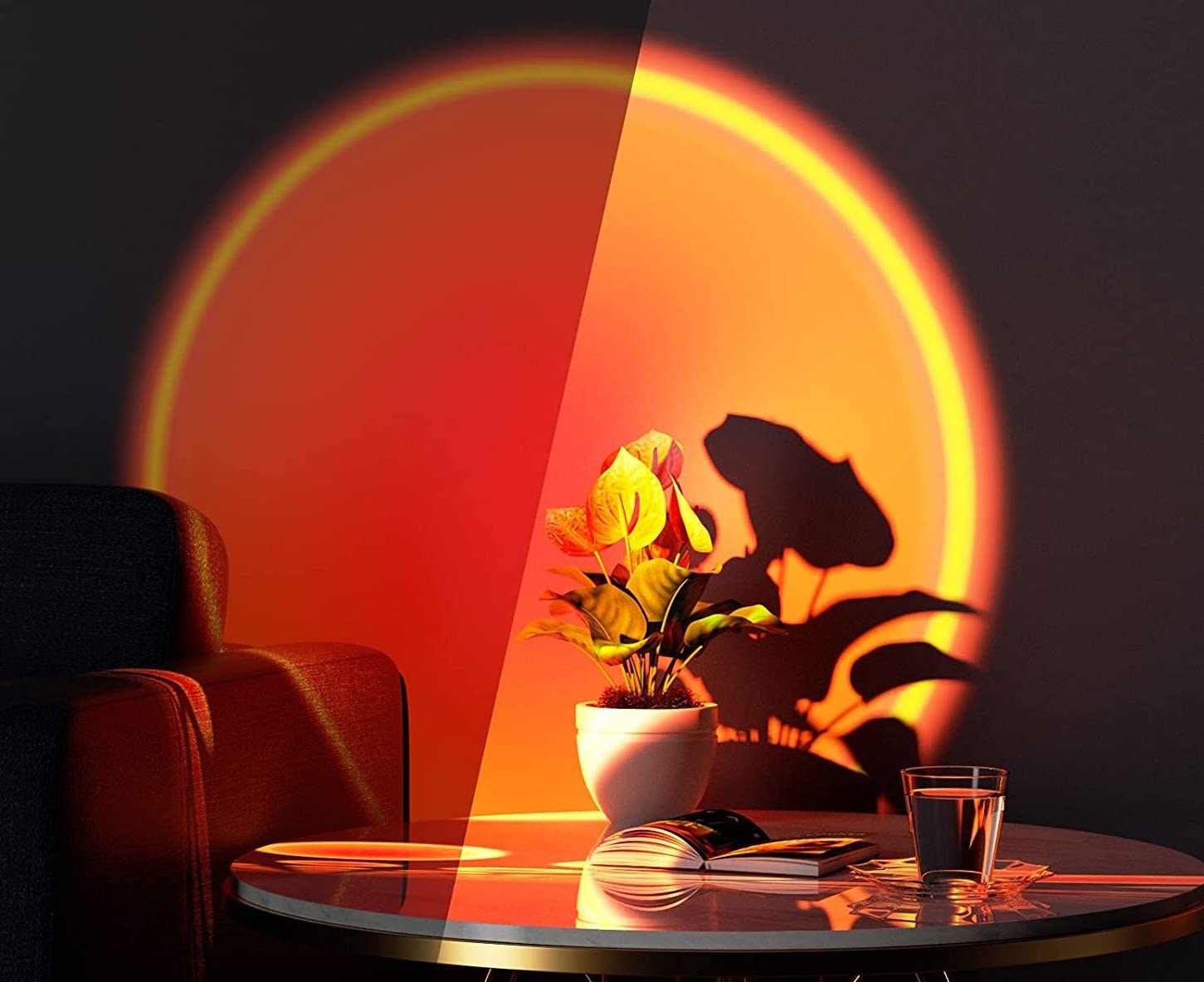 lamp projecting orange light onto wall behind coffee table and plant