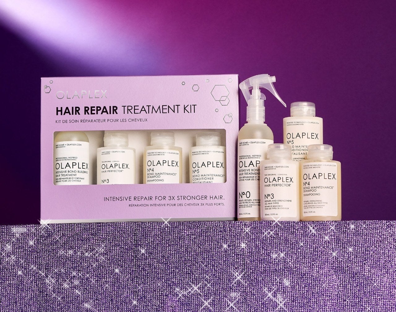 the four piece olaplex hair treatment set on a colourful glittery surface