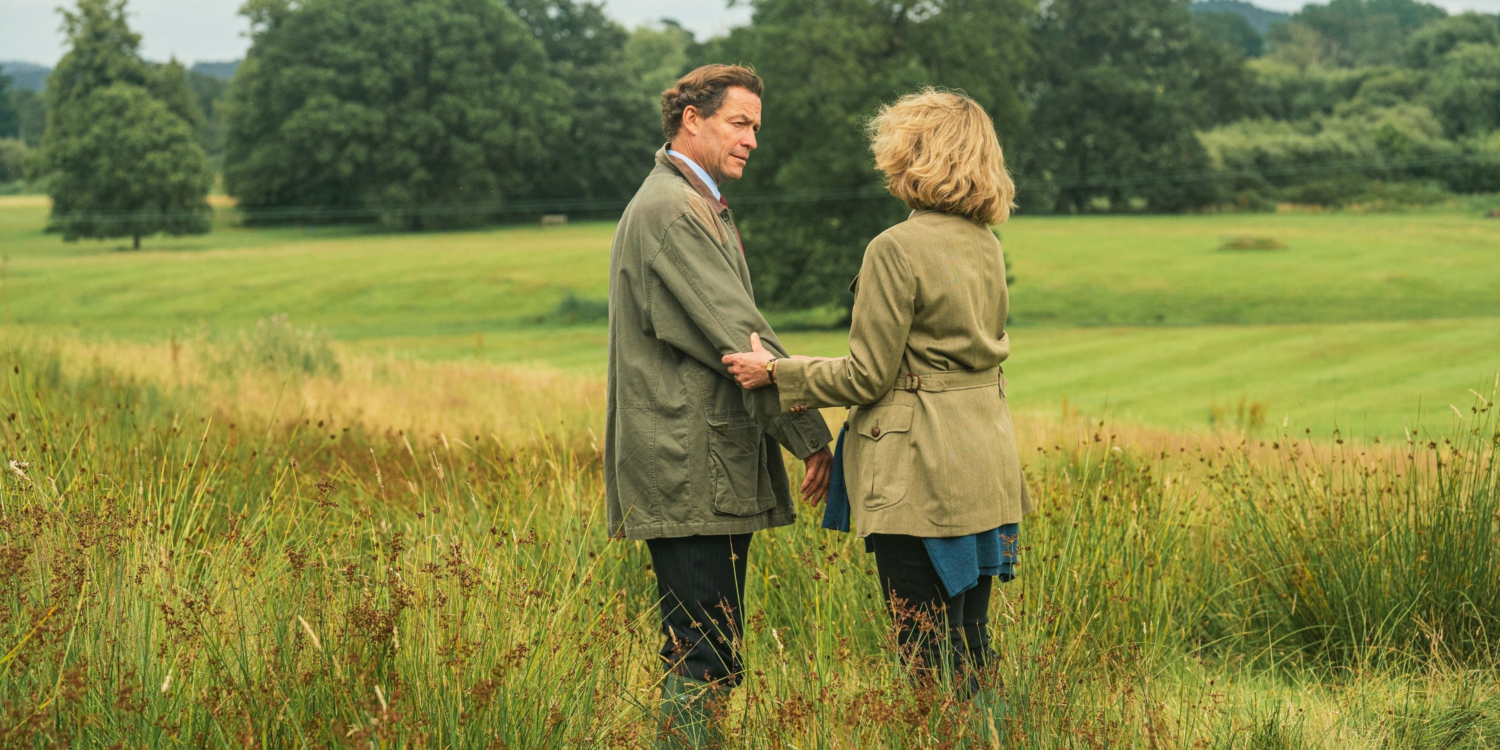 Dominic as Prince Charles standing in a field with Camilla