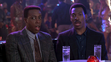 Eddie Murphy and Arsenio Hall stare with their mouths open in Coming To America