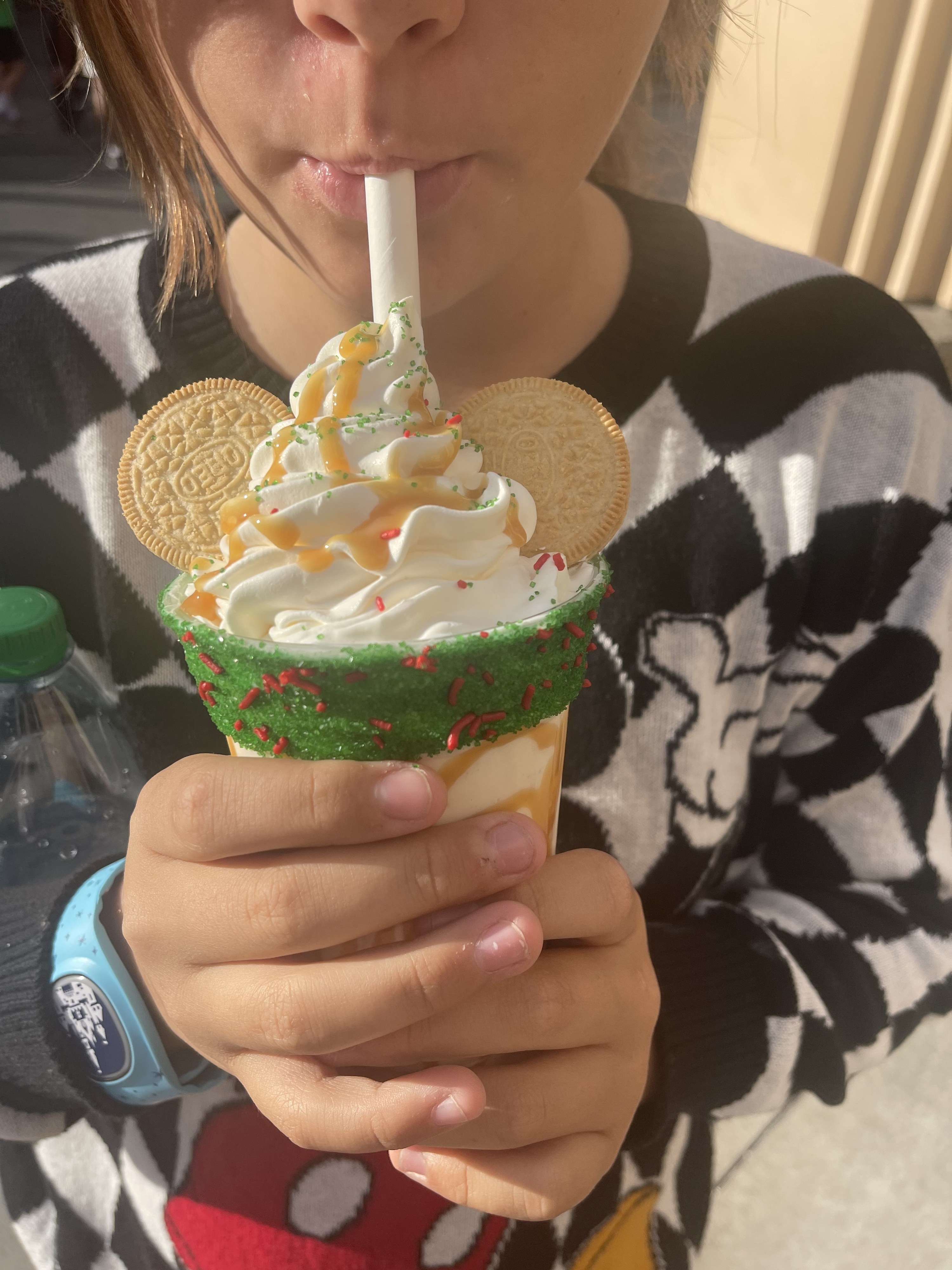 the author&#x27;s daughter drinking a holiday shake