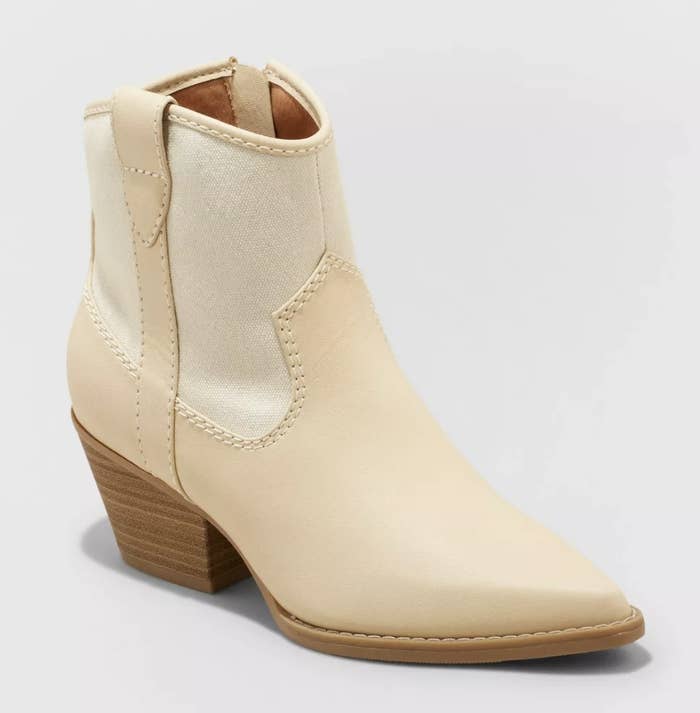 A pair of tan western ankle booties