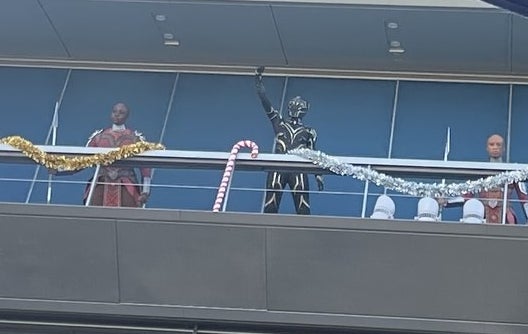 Black Panther waving from a balcony