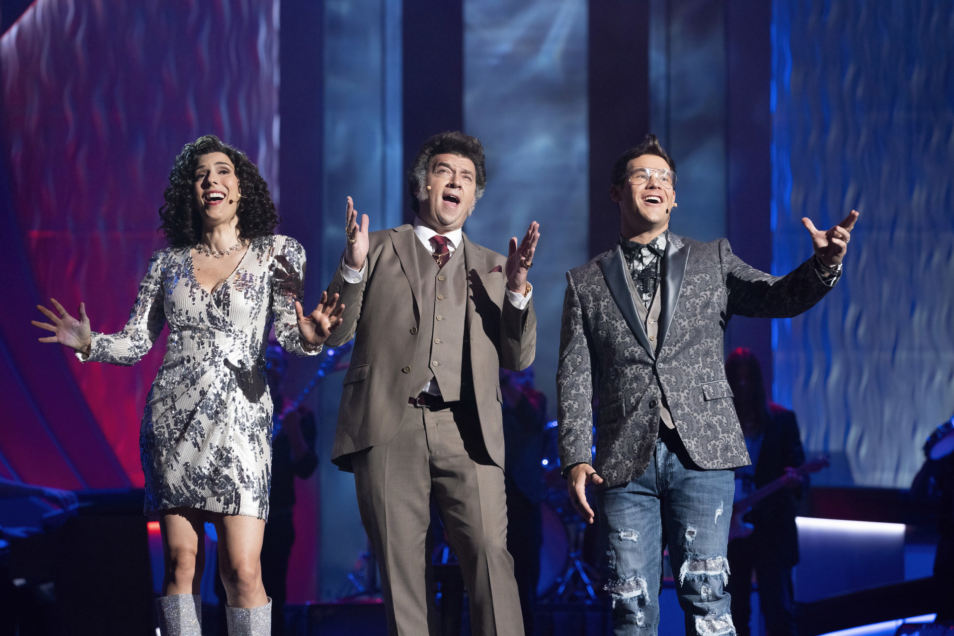 Three adult children sing on stage at church in the TV show Righteous Gemstones.