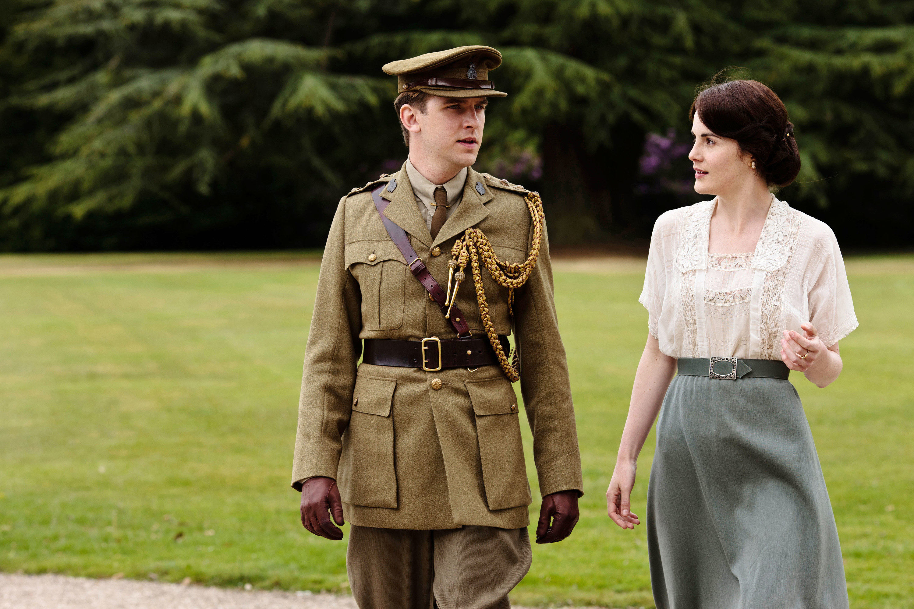 Dan Stevens and Michelle Dockery take a walk outside in Downton Abbey.