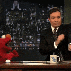 Jimmy Fallon dancing at desk with Elmo