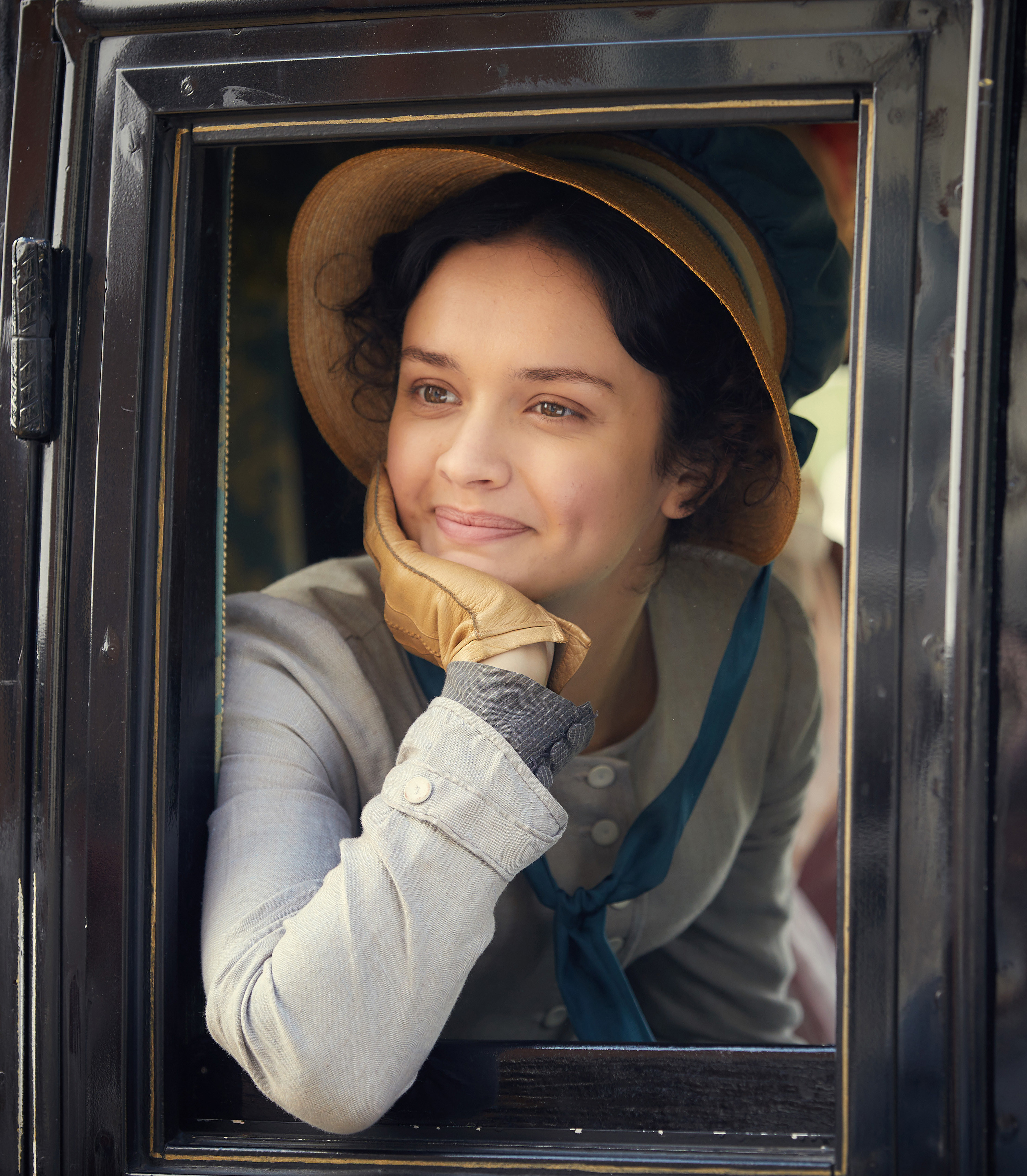 Olivia Cooke sits in a carriage in Vanity Fair.