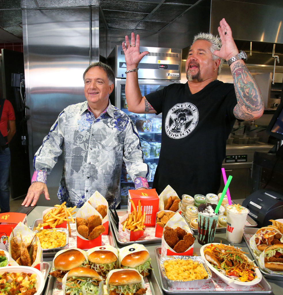 Guy Fieri with hands raised