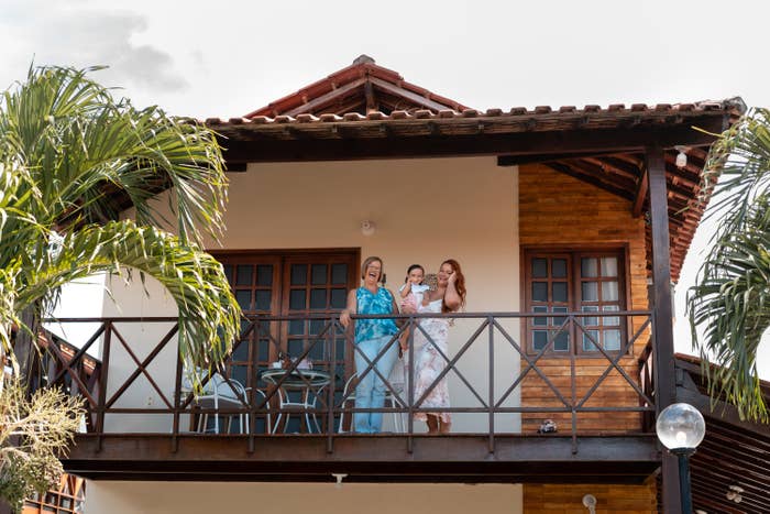 Family on the balcony of their house
