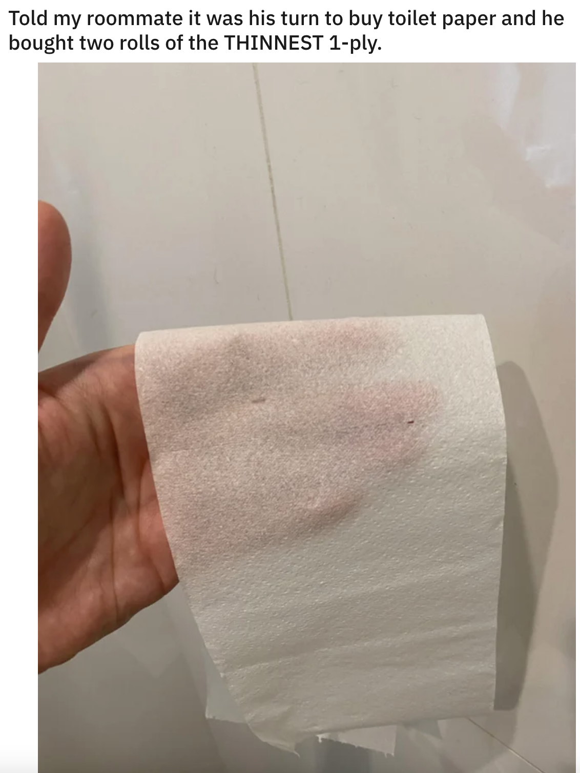 hand holding up see through toilet paper