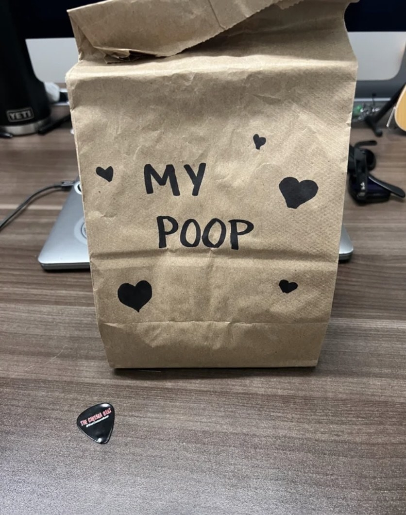 lunch bag labeled &quot;my poop&quot; with hearts drawn around