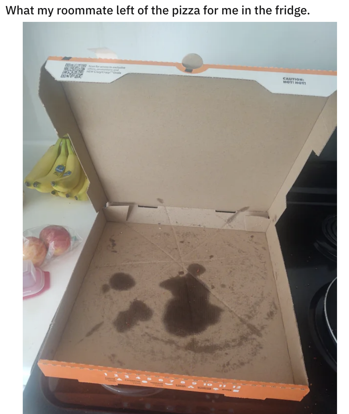 empty pizza box on the kitchen counter