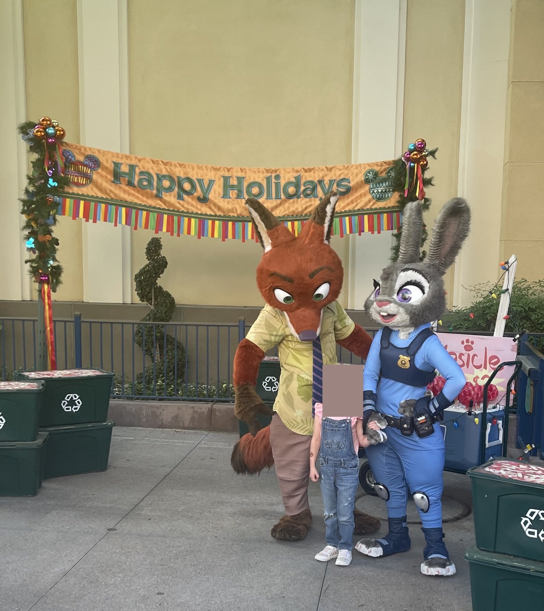 Judy and Nick from Zootopia with a child