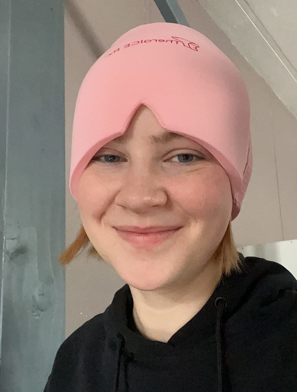 a person wearing their headband in pink