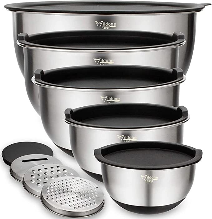 A picture of five stainless steel bowls with lids and four circular grators