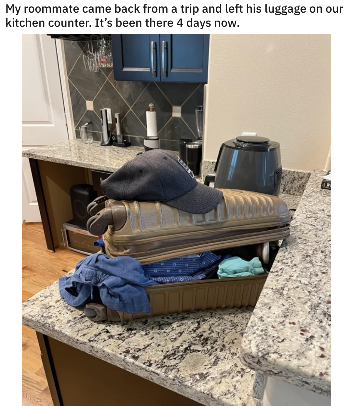 opened luggage left on the kitchen counter