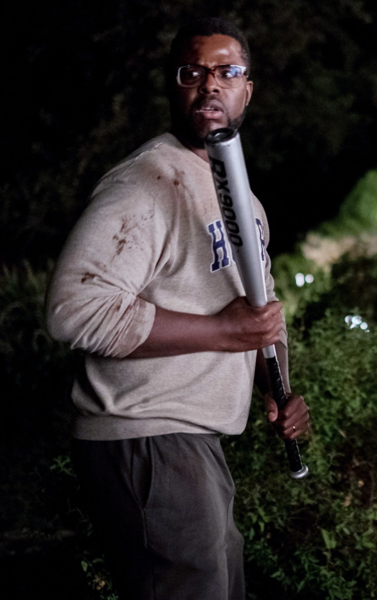 Winston Duke in Us holding a bat