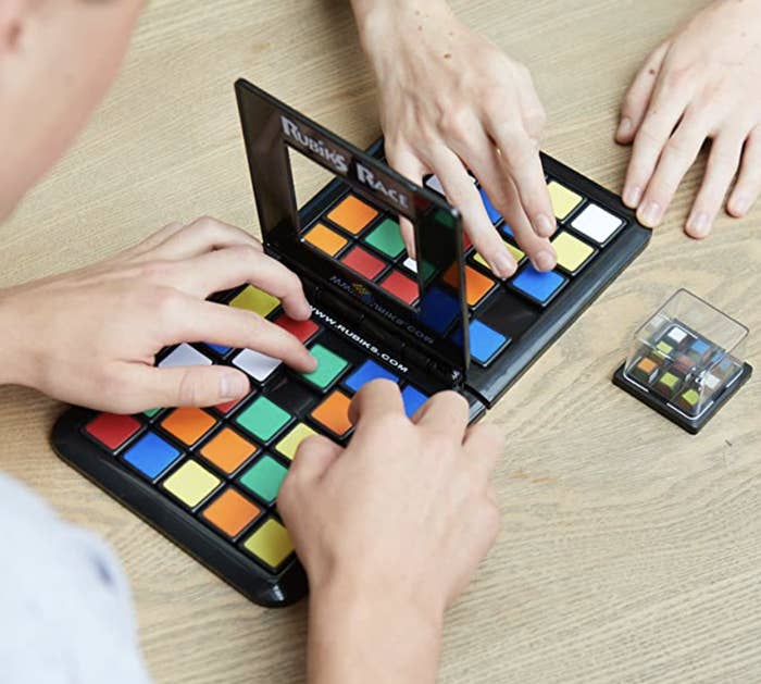 two people playing on the rubix race game