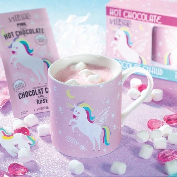 a unicorn mug filled with pink hot chocolate