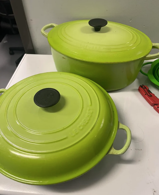 Two green pots on a stove