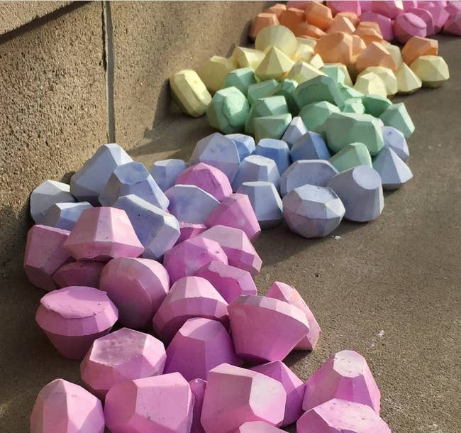 a large organized pile of diamond-shaped chalk in various colors