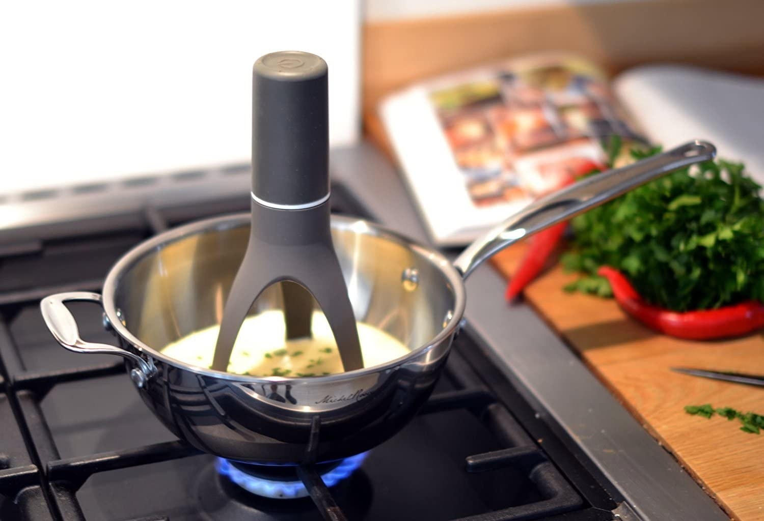 black automatic stirrer in a pan