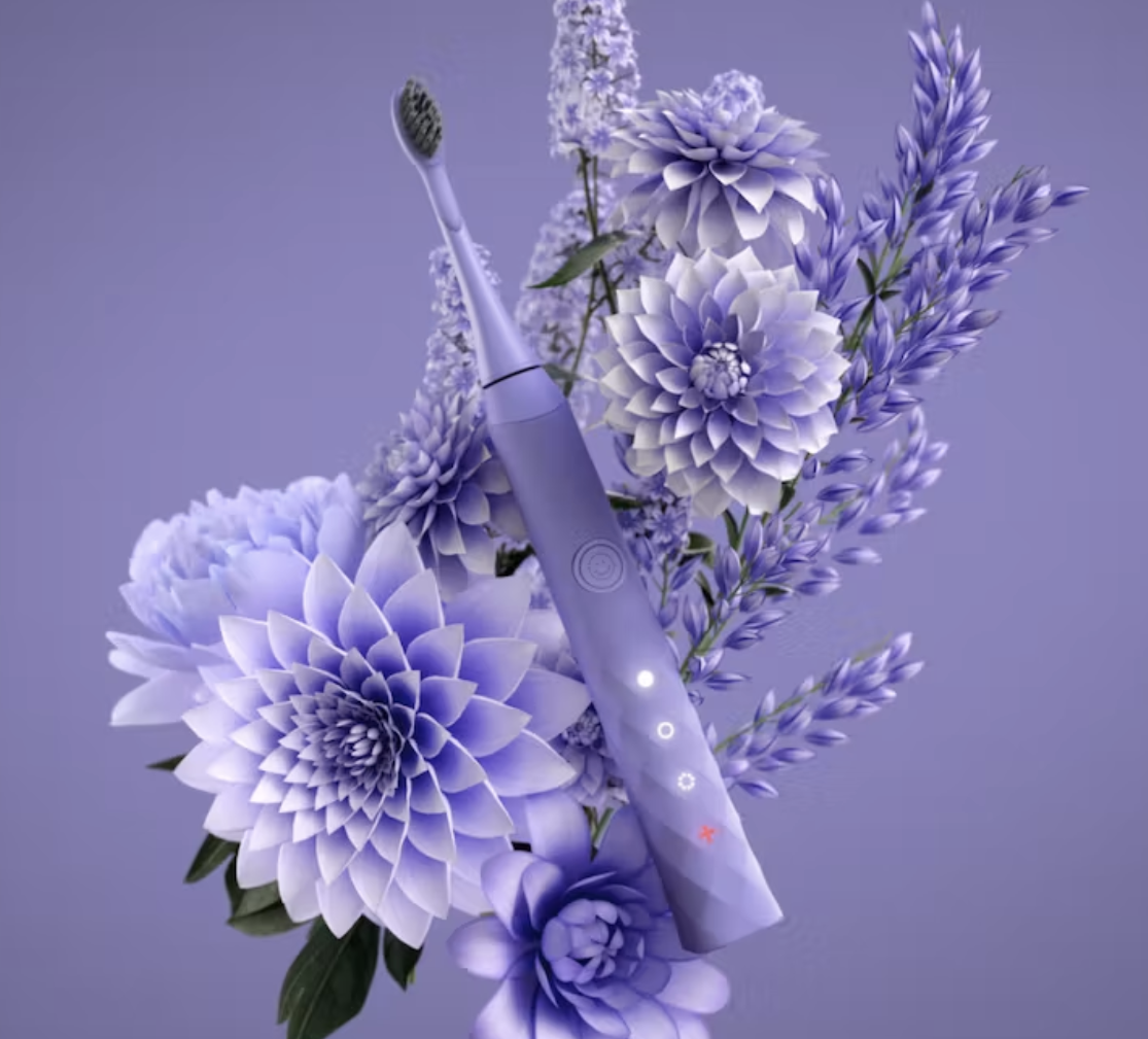 Lavender electric toothbrush on lavender flowers
