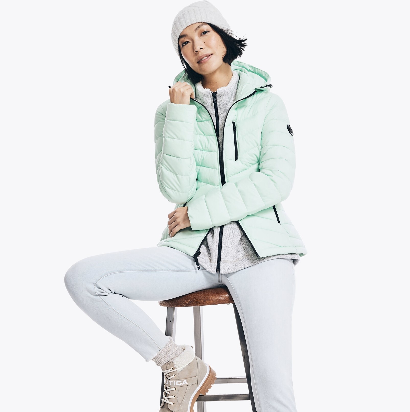 model wearing the quilted puffer in nantucket green