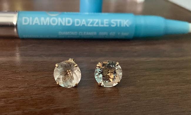 Reviewer's diamond earrings, one visibly not cleaned and one sparkling clean after using the diamond stick