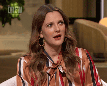 Drew Barrymore shifting her eyes and opening her mouth