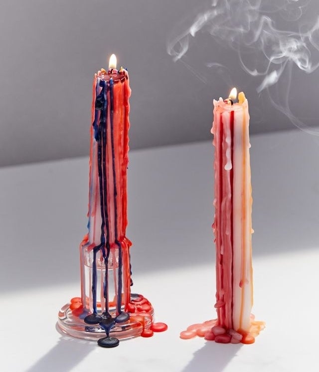 two taper candles with vibrant drippings