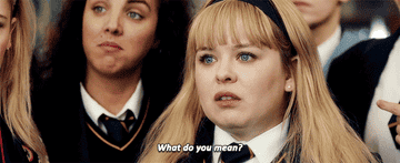A blonde teenaged girl asks, &quot;what do you mean?&quot; she wears a school uniform.