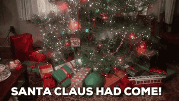 a gif of a christmas tree with presents under it and the words &quot;santa claus had come!&quot;