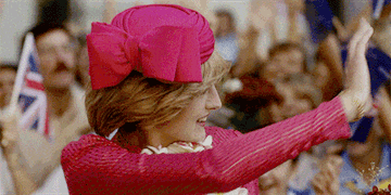 Princess Diana waves to an audience in The Crown.